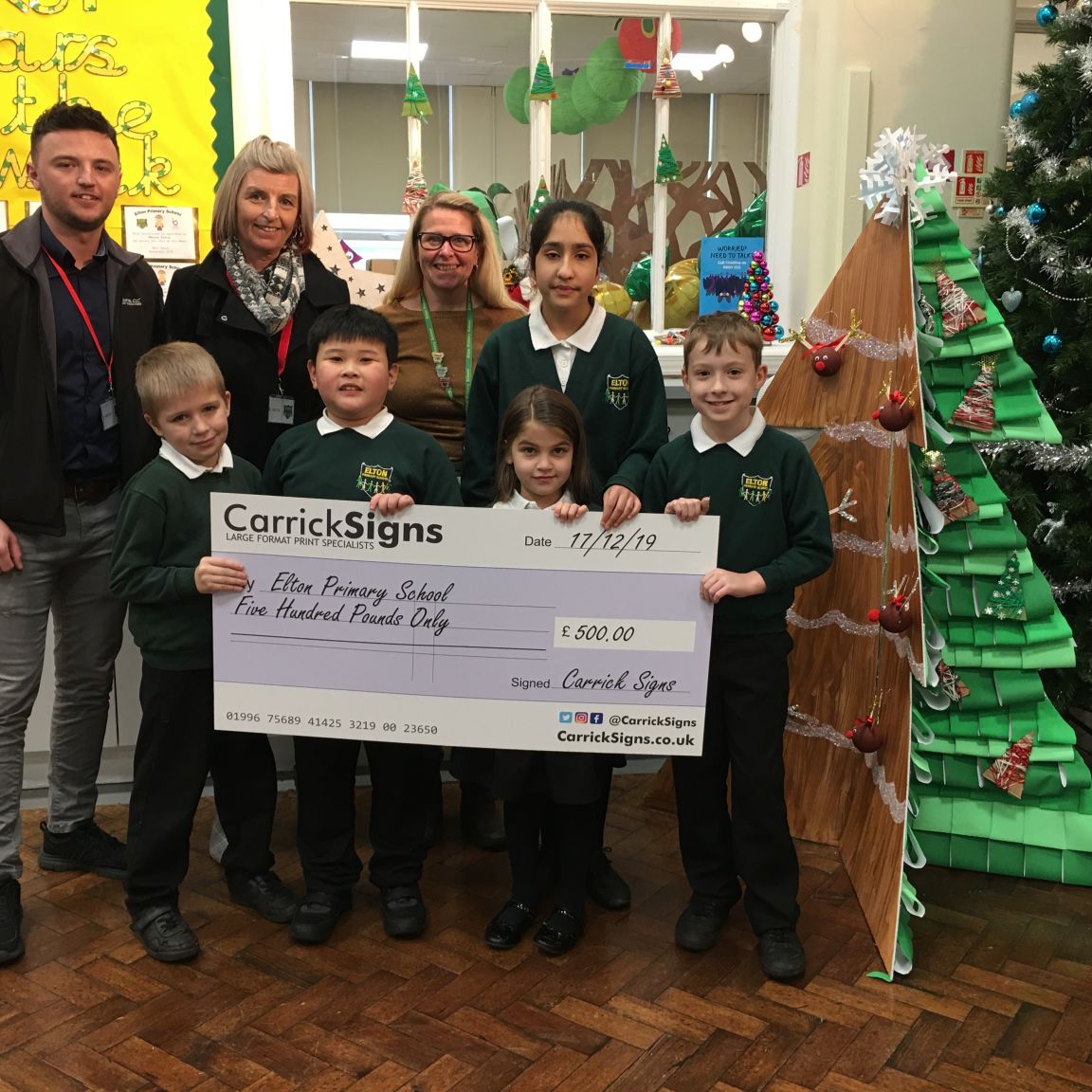 Carrick Signs presenting cheque to Elton Primary School